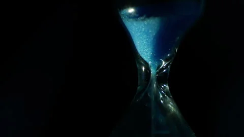 Hourglass. Extreme macro. Time flow. Einstein's theory of relativity. The cyclic Stock Footage 252805418
