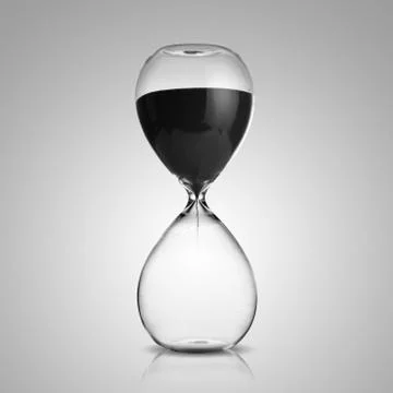 Hourglass on gray background Stock Photos