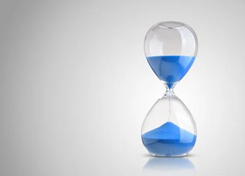 Hourglass on gray background Stockfoto's