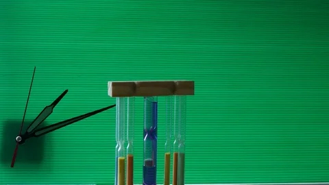 Hourglass on green background, Stock-Footage 81366340