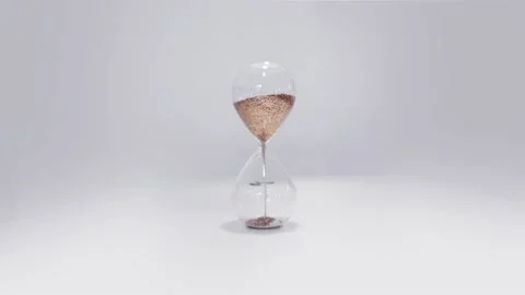 Hourglass on the grey background Video stock 136236578