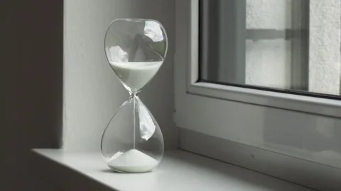 Hourglass next to a window. Stock Footage 222821964