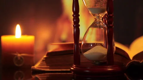 Hourglass with an open book. Stock Footage 1807432