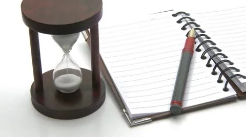Hourglass pen notebook time concept Stock Footage 8849787