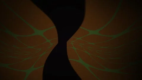 Hourglass with sand flowing through it on a dark background. Stock Footage 337515324