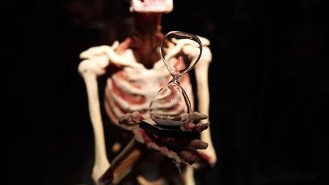 Hourglass in skeleton hands dark concept Stock Footage 330679627