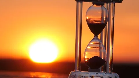 Hourglass on the sunset 스톡 동영상 73953643