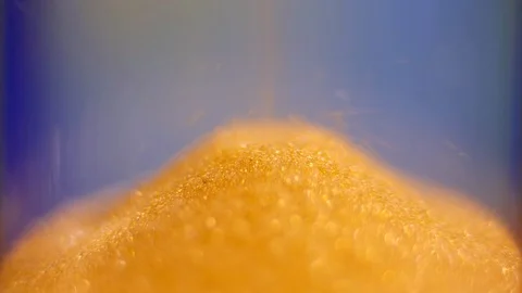 Hourglass. Super Close-up View of Sand Flowing Through an Hourglass. Stock-Footage 88185649