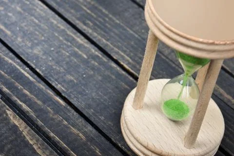 Hourglass on table Stock Photos