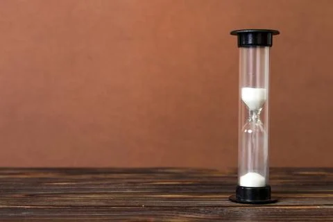 Hourglass on the table, sand clock as time passing concept for business dea.. Stock Photos