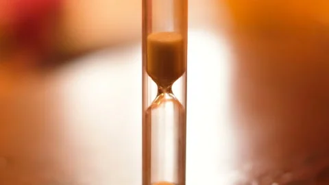 Hourglass time flow on blurred ligiht background,time passing countdown concept Stock Footage 146755883