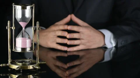 Hourglass. time is running out. a man in a business suit Stock Footage 63034053