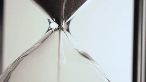Hourglass timer with slow flowing sand on white background Stock Footage 199754827