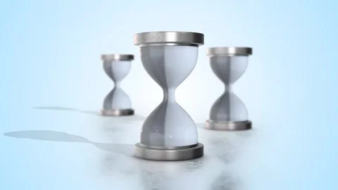 Hourglasses with Silver Color Frame on a Reflective Floor. Loading and Waiting. Stock Footage 291324079