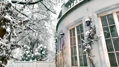 The house after a snowfall during the winter months. There is a thick layer of Video stock 221168224