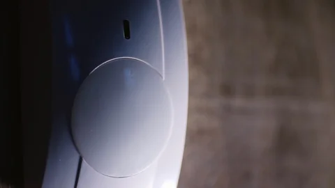 The house alarm is on the wall. The red motion sensor trigger is lit Stock Footage 129290817