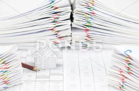 House and pencil have blur document as foreground and background Stock Photos