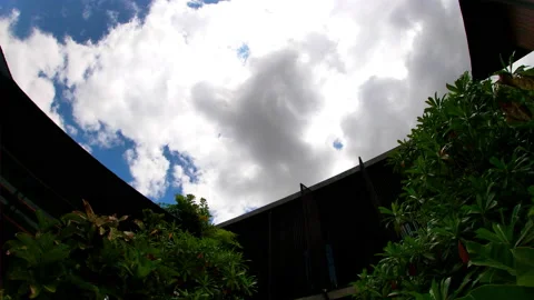 House and sky clouds moving fast Stock Footage 159782706