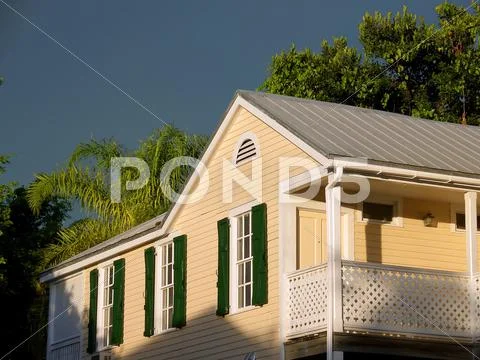 House and storm at sunset Stock Photos