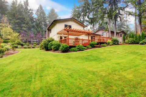 House with backyard landscape Stock Photos