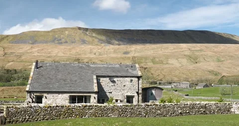 A house barn conversion in Chapel-le-Dale, below Whernside, Yorkshire Dales,  Video stock 255380337