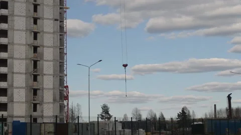 The house is being built. Crane hook hanging freely Stock Footage 132216780