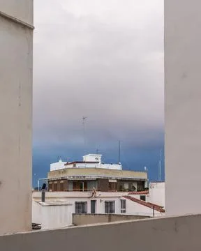 House between Buildings in the Evening Stock Photos