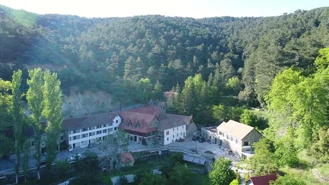 House between the green mountain hills Stock Footage 78561617