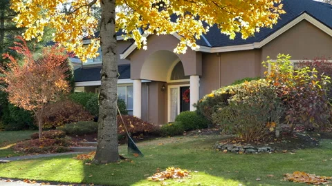 House with big tree and nice Fall Foliage landscape Stock Footage 219949623