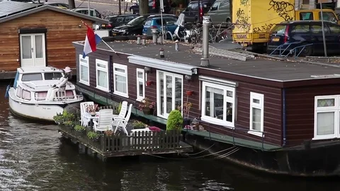 House boat in a canal in amsterdam Stock Footage 71263353