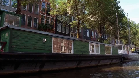 House boats in the canals of Amsterdam Stock Footage