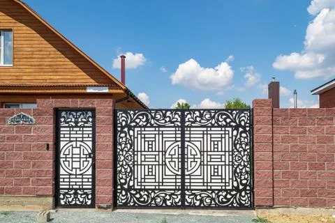 House with a brick fence Stock Photos