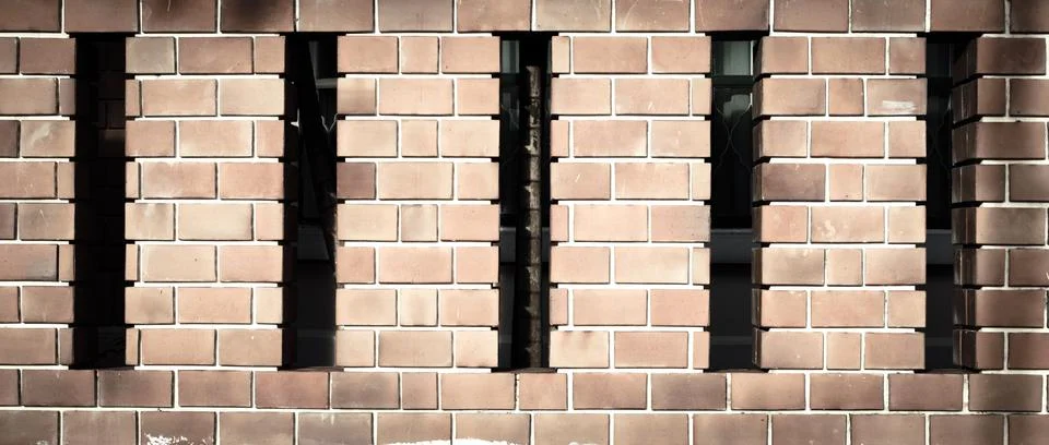 House brick wall with space between posts Stock Photos