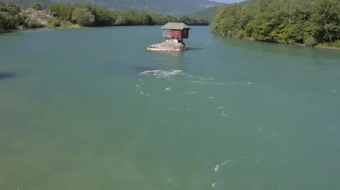 House built on the rock in the river Stock Footage 48681143