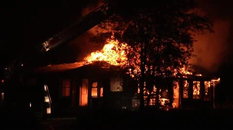 House Burns with Fire Department Crane in View Stock Footage