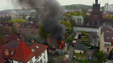 House Caught In Fire As Firefighters Spray Water On Roof To Stop Spread Quickly Stock Footage 315351359