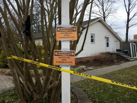 House with caution warning lead work poison no eating sign Stock Photos