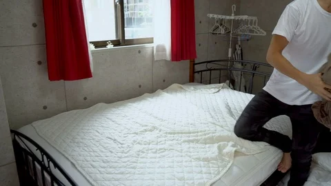 House Chore Work - Japanese Man Changing Bed Sheet Stock Footage 104477916