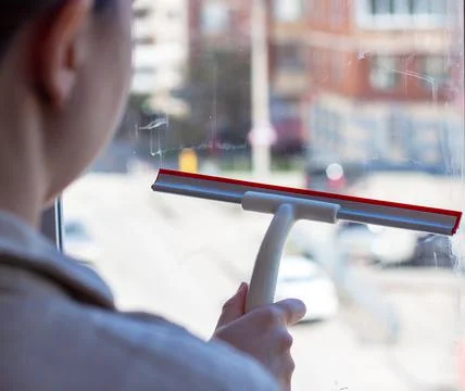 House cleaning a window Stock Photos