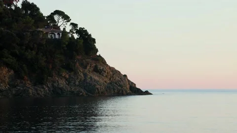 House on a cliff during sunset Stock Footage 223250033