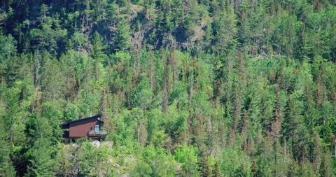 House in the cliff of the forest mountain Stock Footage 130981858