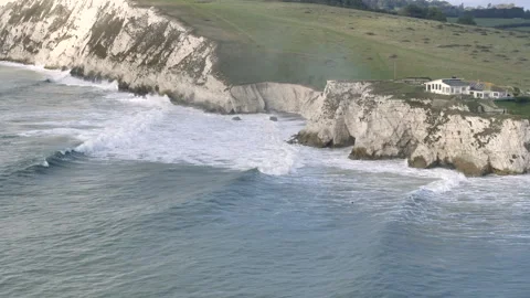 A house is on a cliff overlooking the ocean Stock Footage 298285675