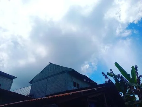 House with cloudy clouds in the background Stock Photos