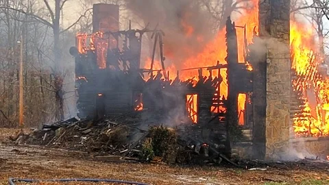 House completely destroyed by fire Stock Footage 73431392