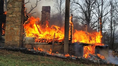 House completely destroyed by fire Stock Footage 73432862