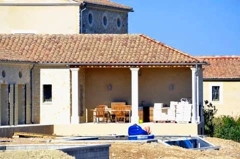 House in construction and its building site Stock Photos