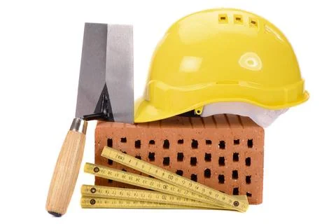 House construction with brick, tools, plan and model house house construct... Stock Photos