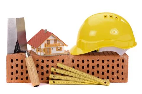 House construction with brick, tools, plan and model house house construct... Stock Photos