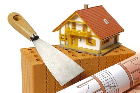House construction with brick, tools, plan and model house house construct... Stock Photos