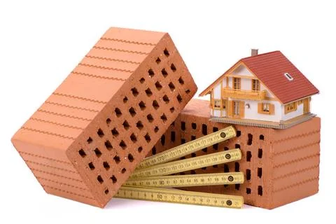 House construction with brick, tools, plan and model house house construct... Stock Photos